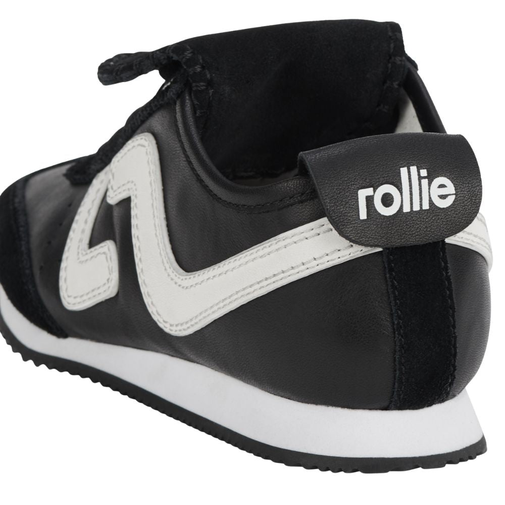 Black and white shoe with 'Rollie' branding on a white background