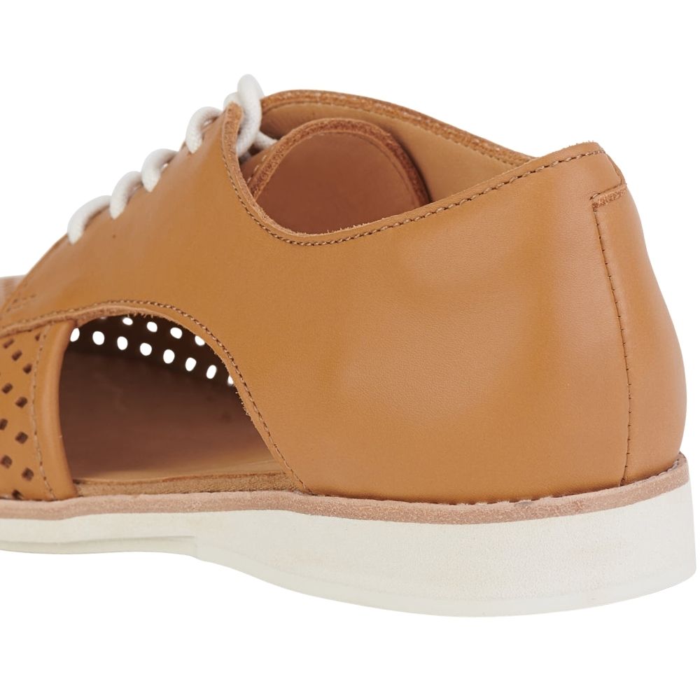 A close-up rear three-quarter view of a tan leather lace-up shoe with a white sole and white laces, featuring a side cutout.