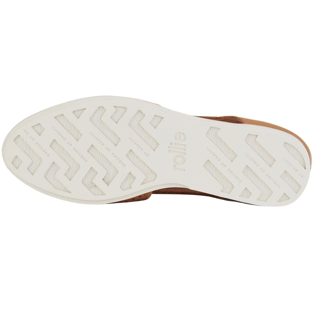 The white rubber outsole of a shoe, showing a tread pattern and the brand name 'Rollie', against a white background.