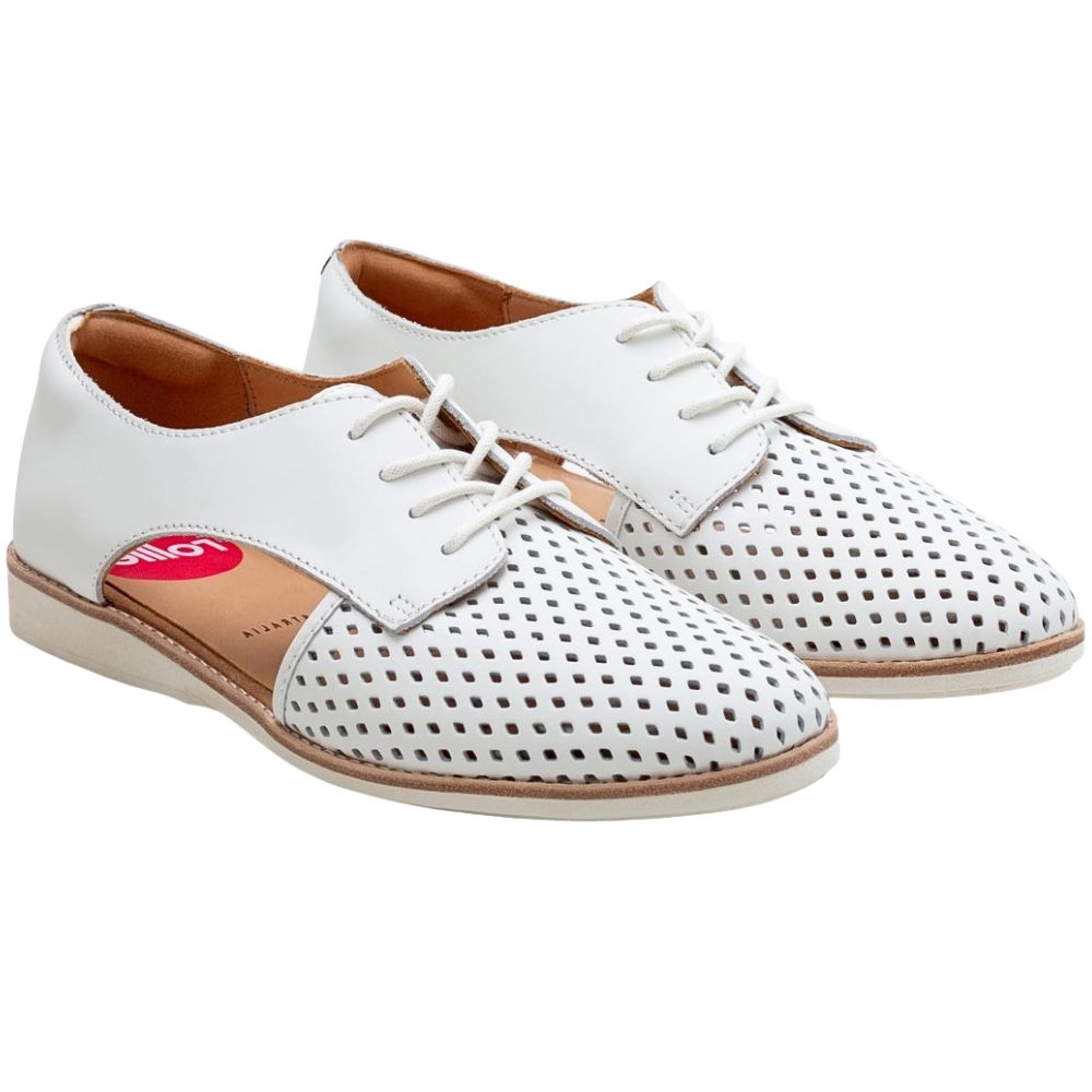 A pair of white leather lace-up shoes with perforated detailing on the toe and vamp, featuring a tan insole and a red circular 'Rollie' logo on the insoles.