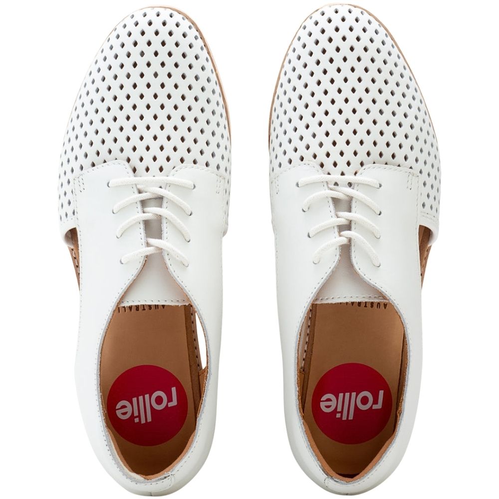 A pair of white leather lace-up shoes with perforated uppers, shown from a top-down view on a white background. The red circular insoles display the brand name 'Rolle'.