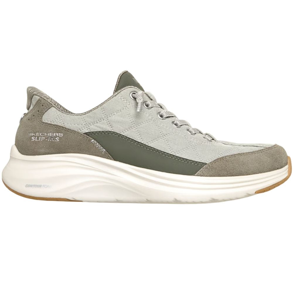 A Skechers Slip-In sneaker in a sage green colorway, featuring a thick white cushioned sole and sage laces, shown from a side profile on a white background.
