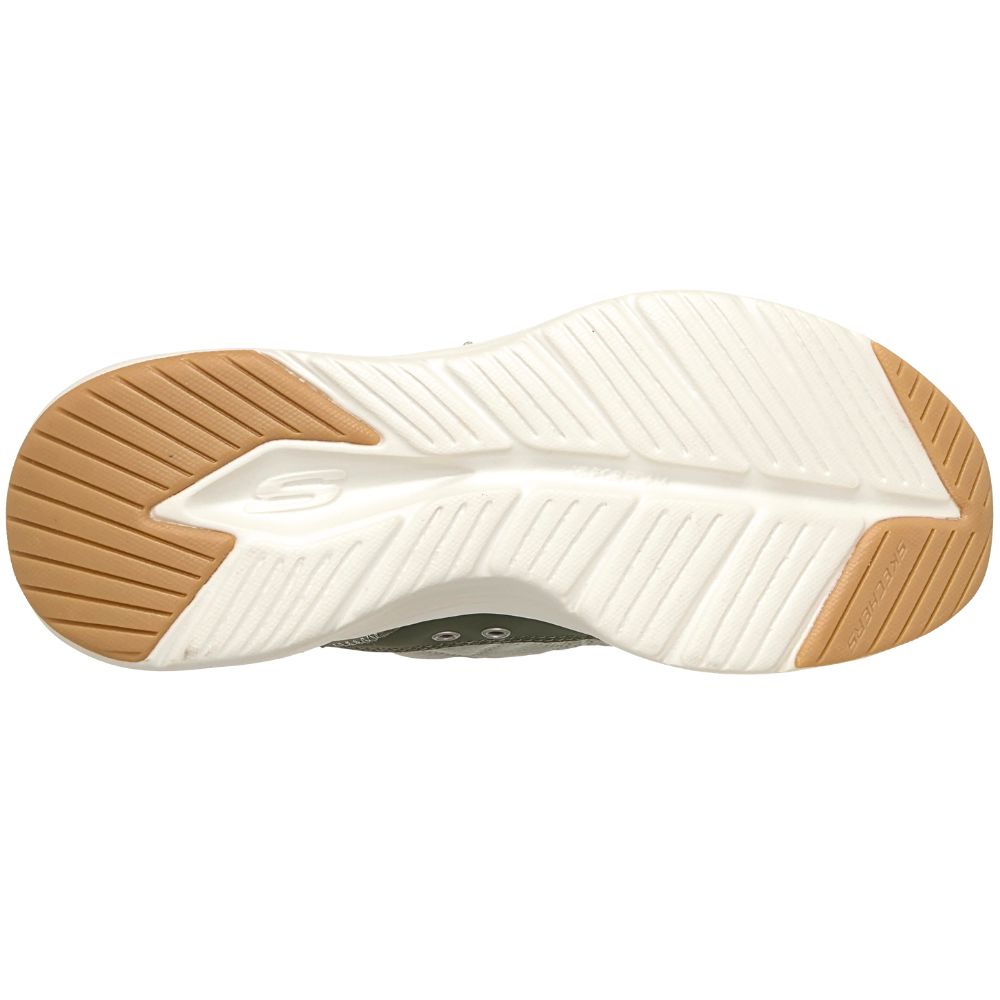 The outsole of a Skechers athletic shoe, featuring a white ribbed midsole with a subtle embossed 'S' logo and tan rubber outsole sections.