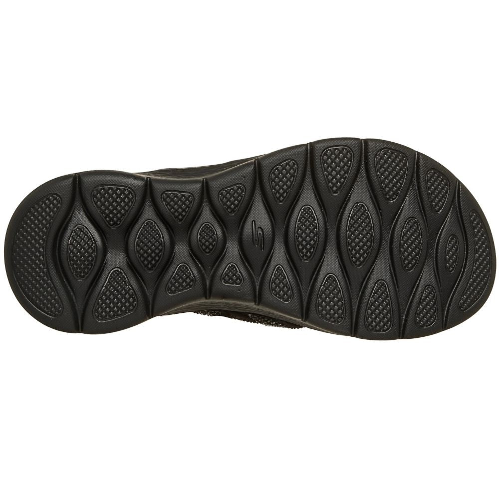 The black textured rubber outsole of a Skechers sandal, shown from a top-down view against a plain white background.