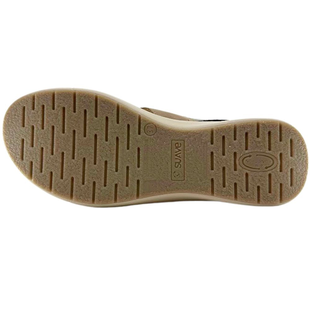 The outsole of a shoe shown from a top-down view, featuring a tan textured tread pattern with the brand name 'SUAVE' embossed in the center.