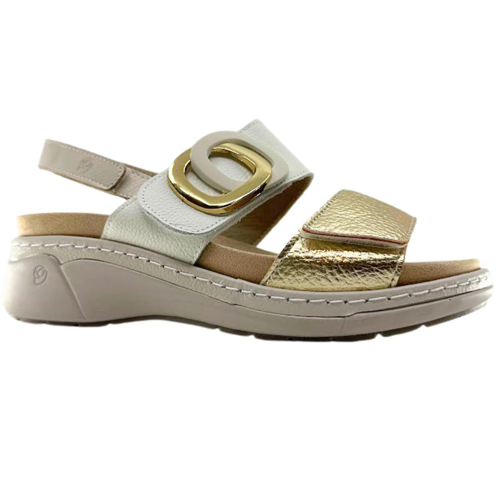 A women's platform sandal featuring a light beige leather slingback strap with a large gold-tone oval buckle, a textured metallic gold toe strap, and a beige sole.