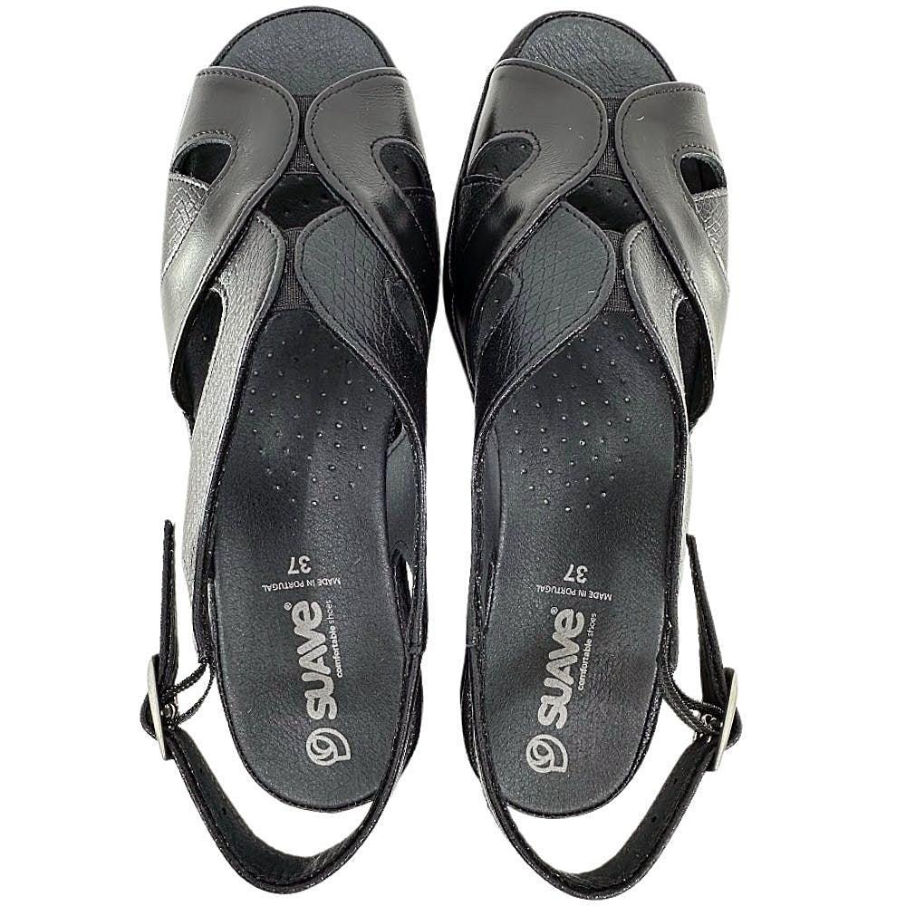 A pair of black leather wedge sandals with cutout straps, shown from a top-down view on a white background. The brand name 'SUAVE' is printed in white on the insoles.