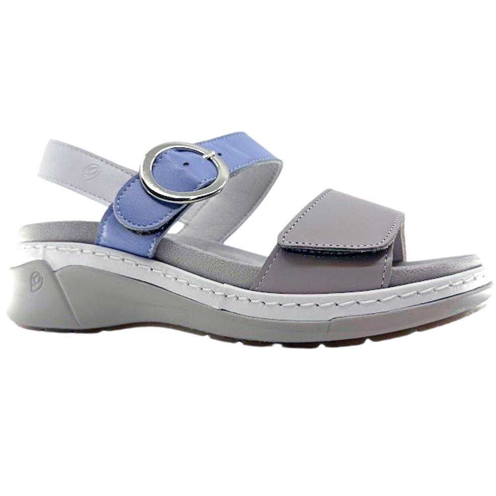 A women's wedge sandal in light gray and periwinkle blue, featuring a hook-and-loop strap design with a silver buckle, shown from a side profile on a white background.