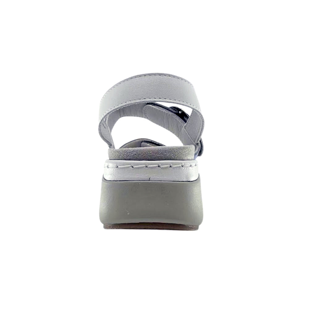 A single light gray platform sandal with an adjustable strap, shown from a rear three-quarter view on a solid white background.