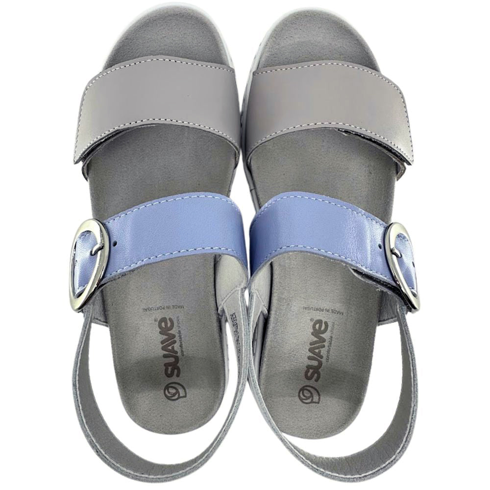 A pair of women's slide sandals in gray and light blue, featuring double straps with silver buckle details, shown from a top-down view on a white background.