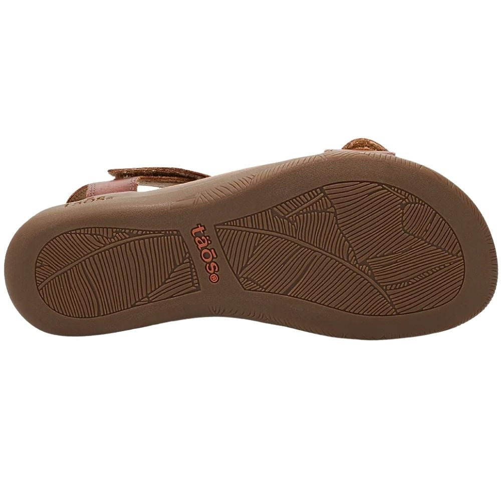Brown Taos sandal sole showing the tread pattern and the red Taos brand logo on a white background.