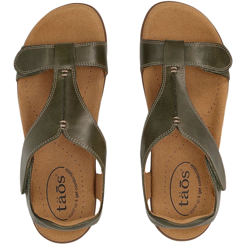 Pair of olive green sandals with 'taos' branding on a white background