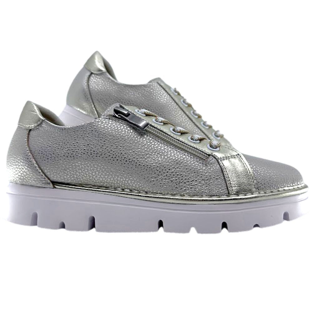 Gold sneakers with a textured finish on a white background