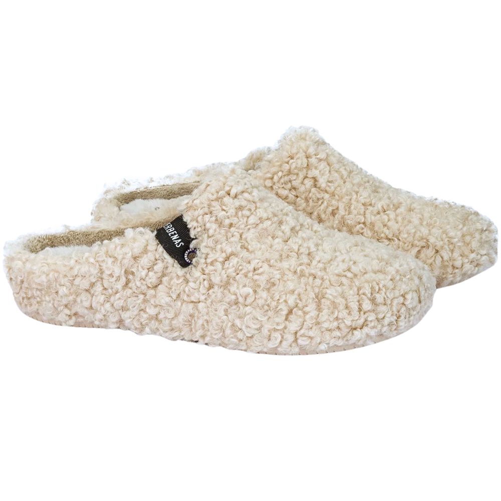Pair of cream-colored slippers with a brand logo on a white background
