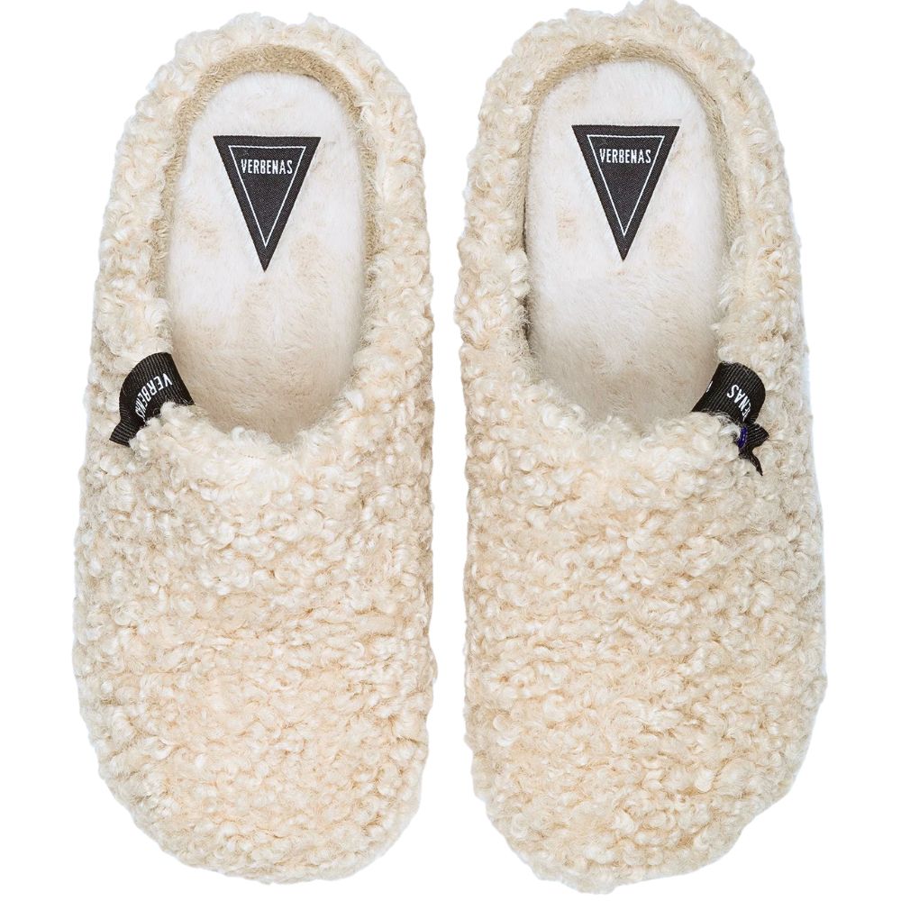 Pair of cream-colored fur slippers with a curly texture on a white background