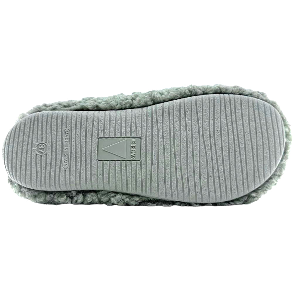 Green slipper with textured sole on a white background