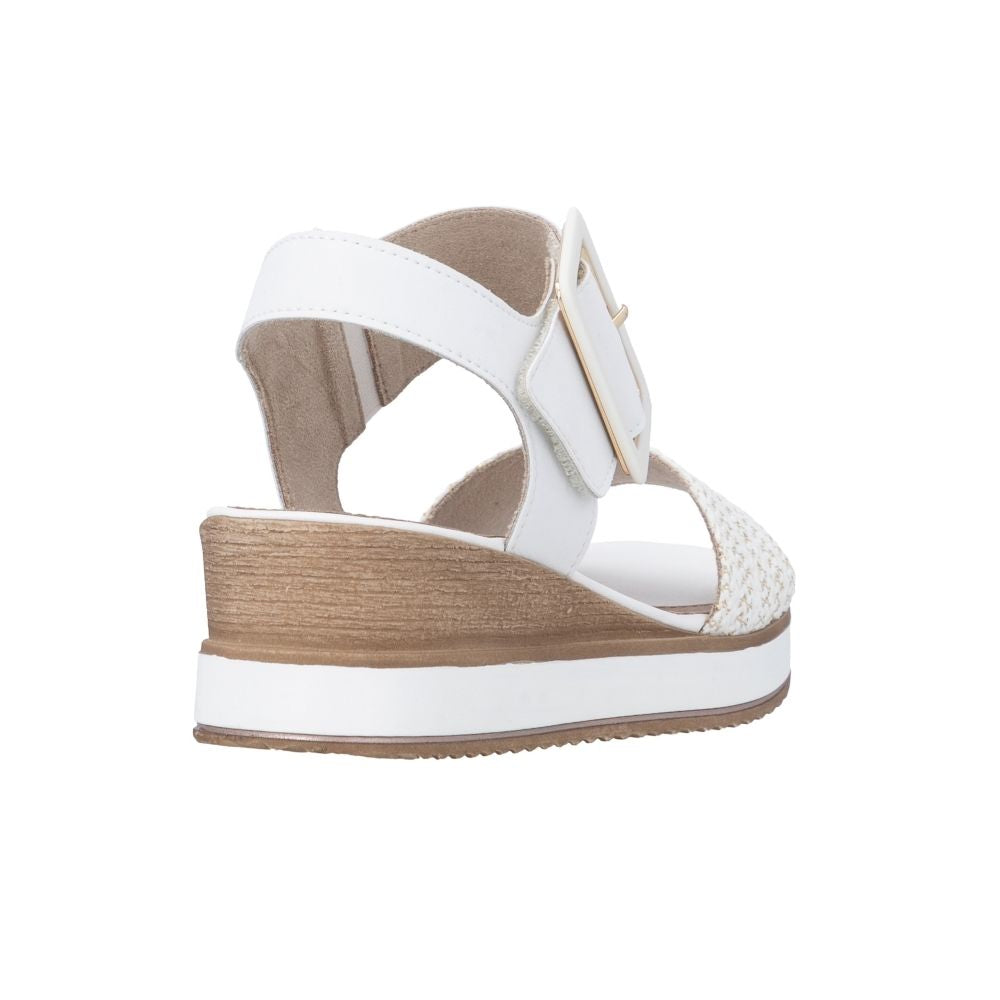 A white wedge sandal with a woven toe strap, a single adjustable strap with a gold-tone buckle, and a stacked platform wedge heel, shown from a side profile on a white background.