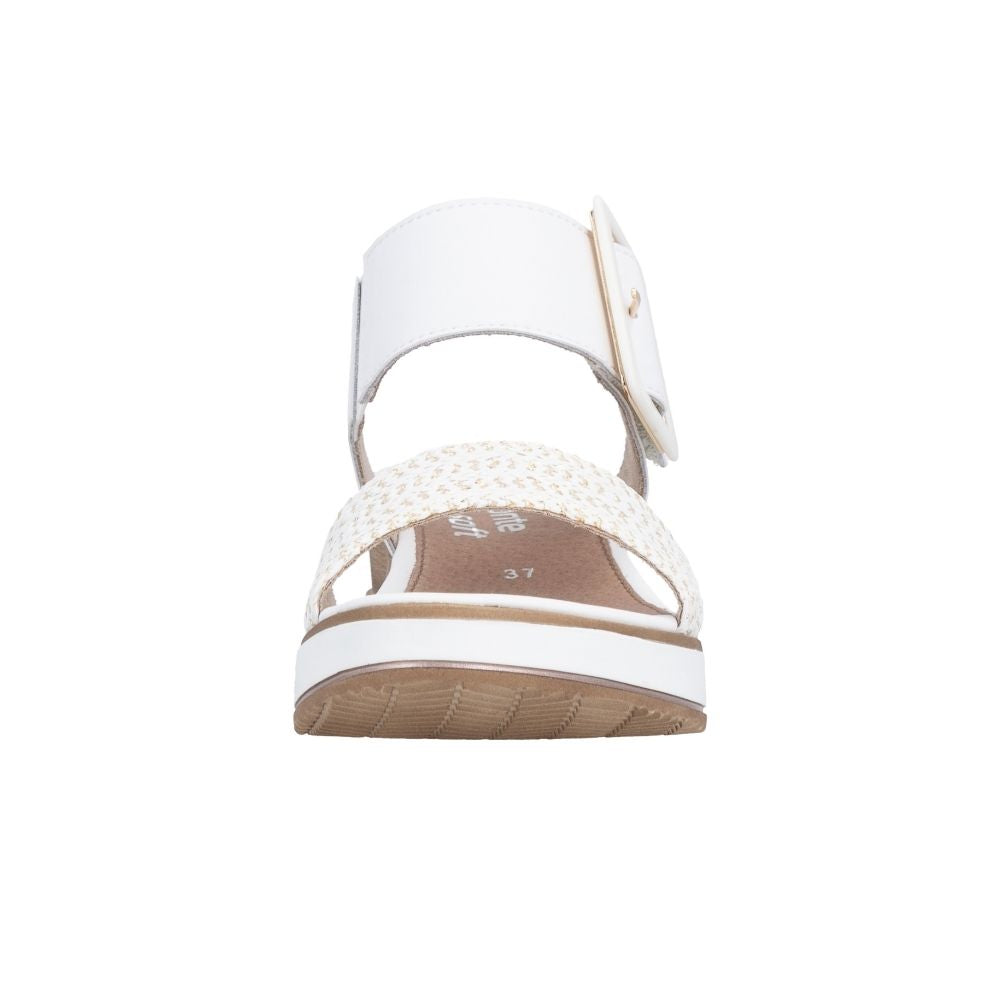 A single white sandal with a woven white and gold strap and a brown textured sole, shown from a front-facing perspective on a solid white background.