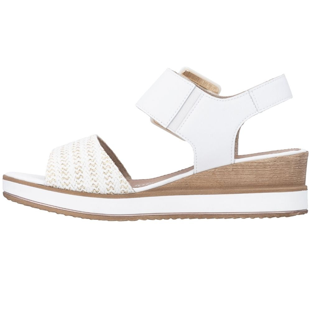 A white wedge sandal with a woven gold and white toe strap, shown in a side profile on a white background.