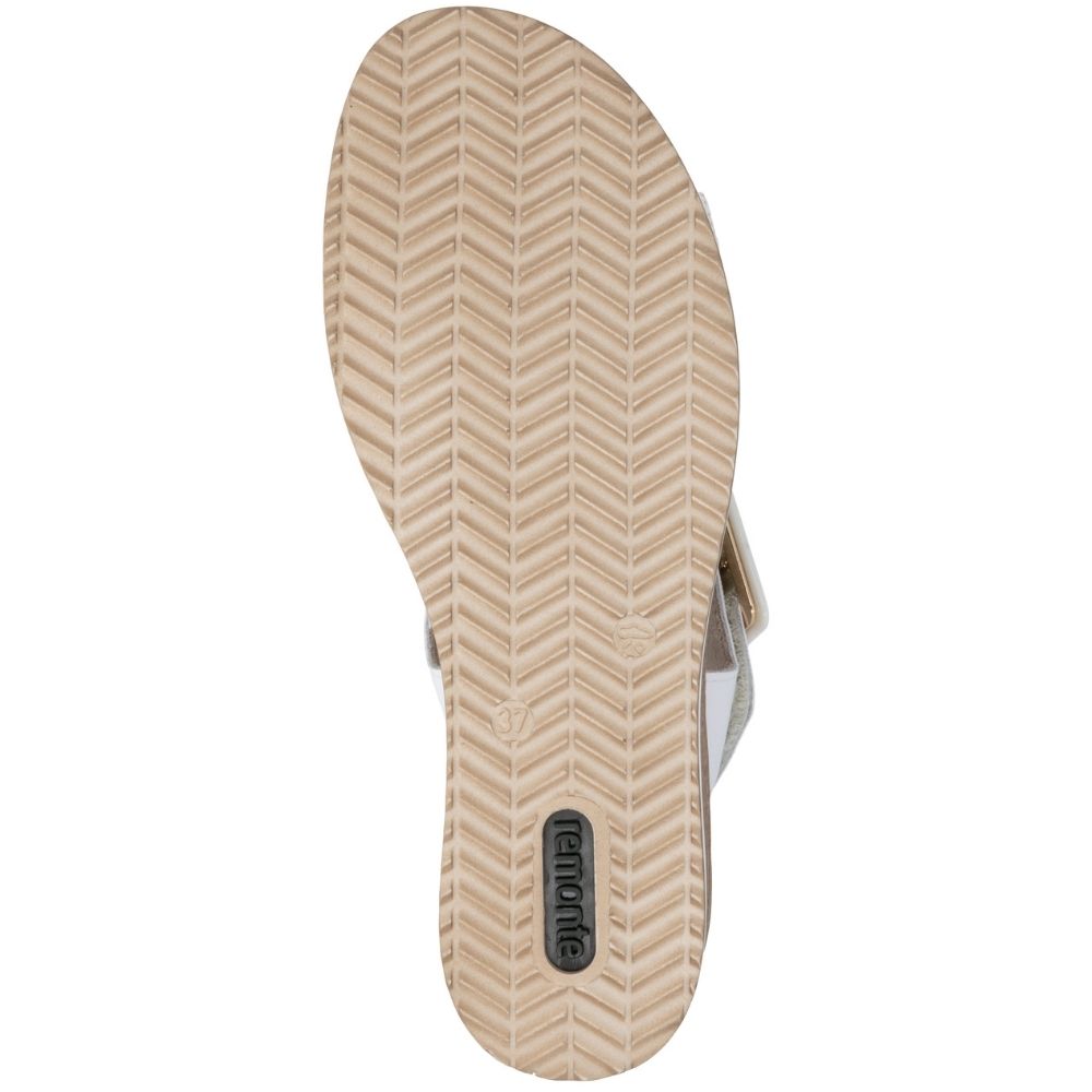 A top-down view of a sandal's beige textured sole, featuring a herringbone pattern and a black 'Remonte' brand logo near the heel, set against a plain white background.
