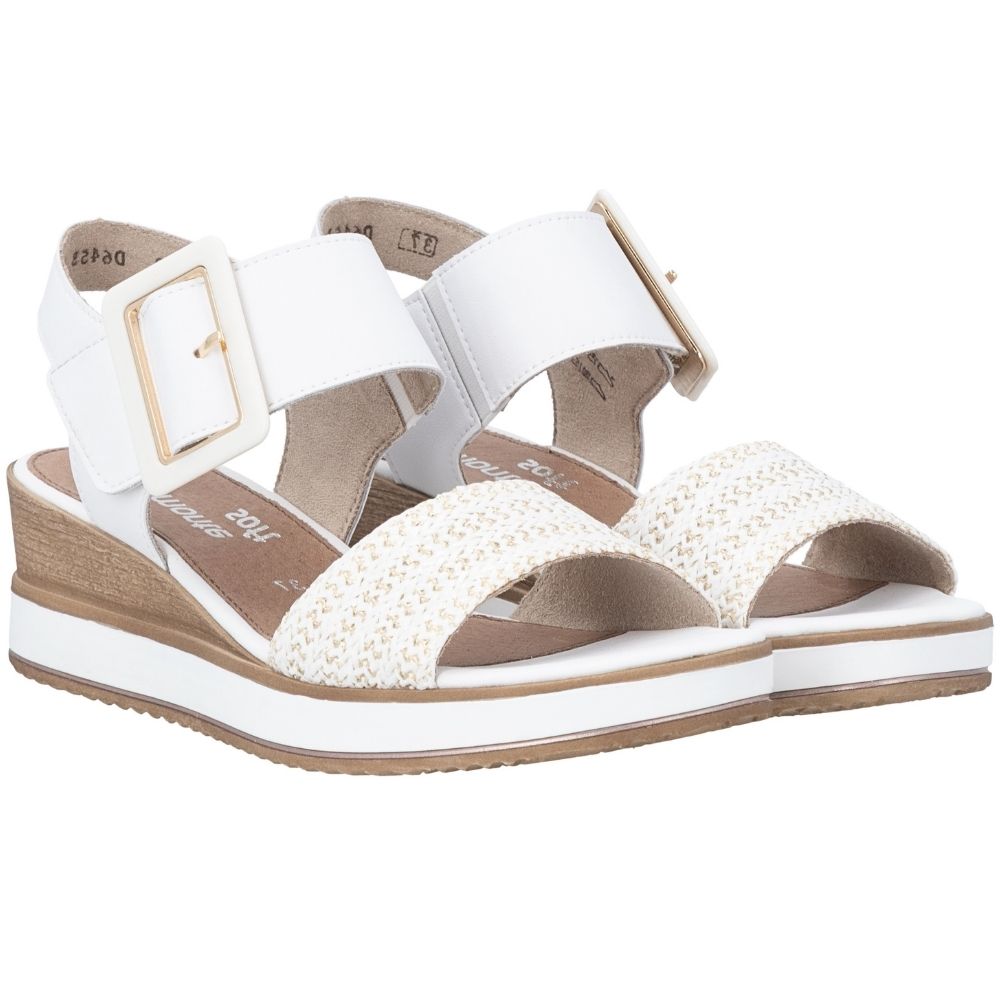 A pair of white wedge sandals with woven textured straps, statement square buckle straps, and a brown wood-look wedge heel, shown on a plain white background.