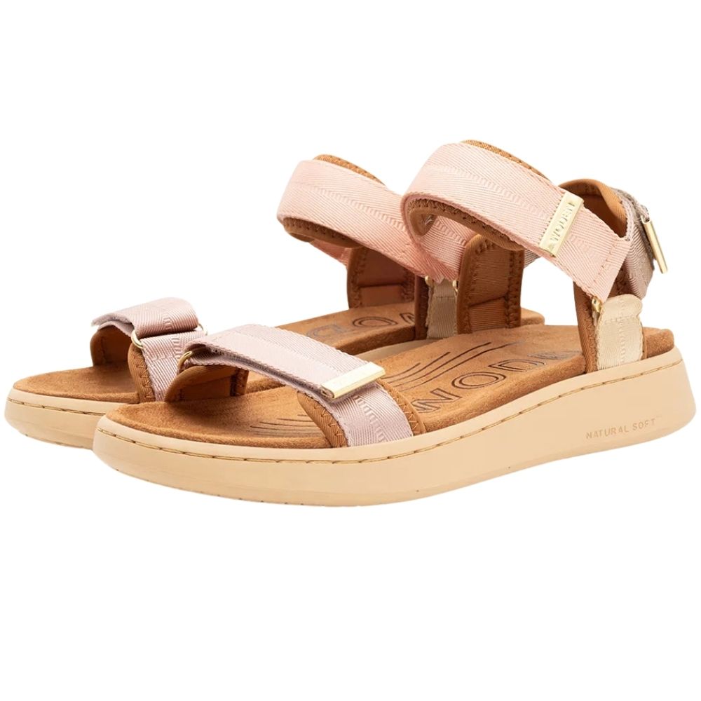 A pair of women's platform sandals by Woden, featuring light blush woven straps with gold-tone hardware, a tan footbed, and a beige sole, shown against a plain white background.