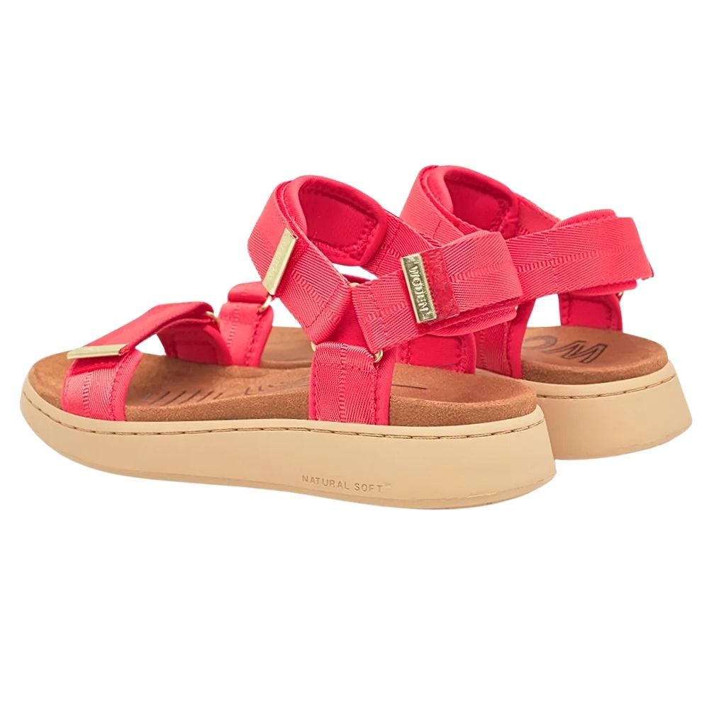 A pair of women's platform sandals in red with moulded microfibre footbeds and beige soles, featuring gold-tone metal hardware on the straps.
