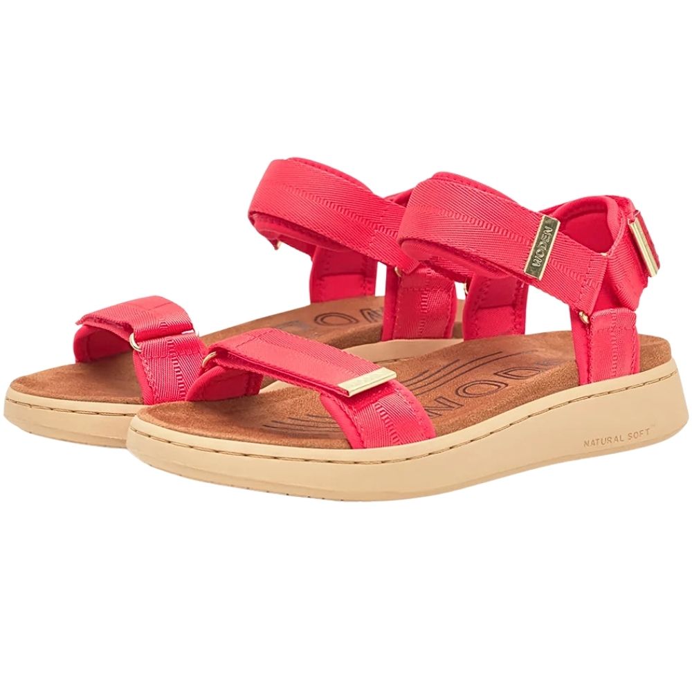 A pair of women's platform sandals in red with moulded microfibre footbeds and beige soles, featuring gold-tone metal hardware on the straps.