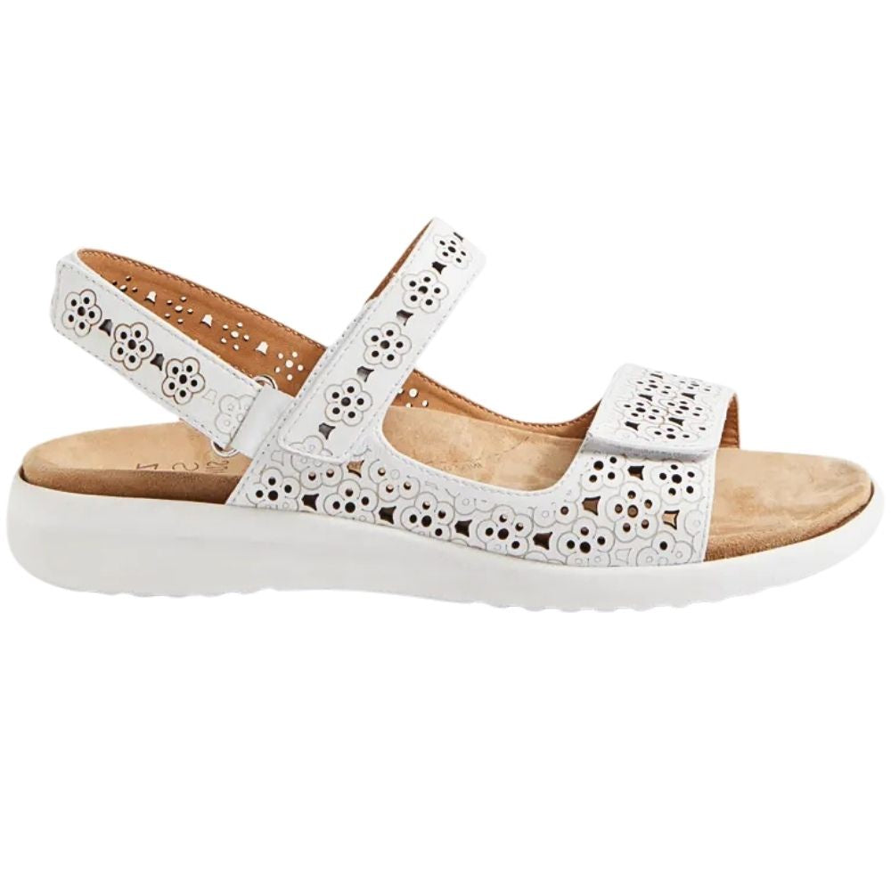 A white open-toe sandal with floral cutout straps and a thick white sole, shown from a side profile on a white background.