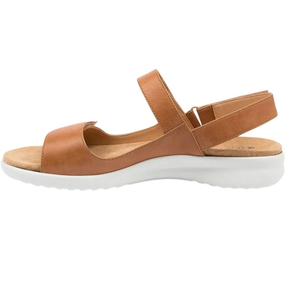 A tan leather ZIERA sandal with a thick white platform sole, shown in a side profile view against a plain white background.