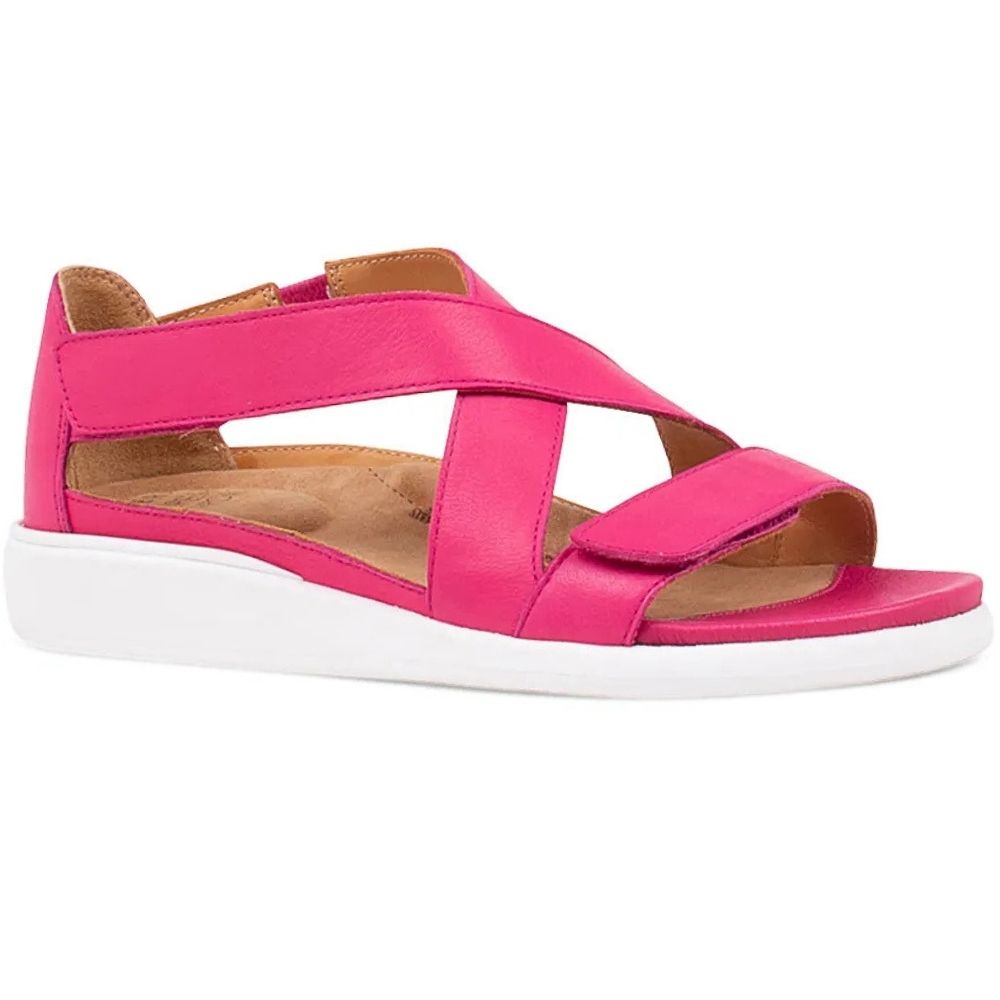 A bright pink leather strappy sandal with a white wedge sole, shown from a side profile view on a white background.