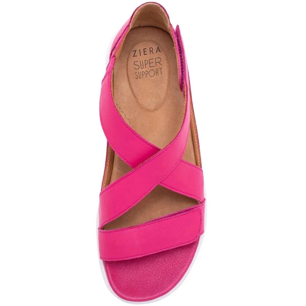 A single Ziera Super Support wedge sandal in vibrant pink leather, featuring criss-crossing straps and a low wedge heel, shown from a top-down view on a white background.