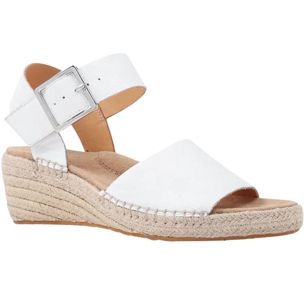 A white leather wedge espadrille sandal with a silver buckle ankle strap and a braided jute wedge heel, shown in a side profile on a white background.