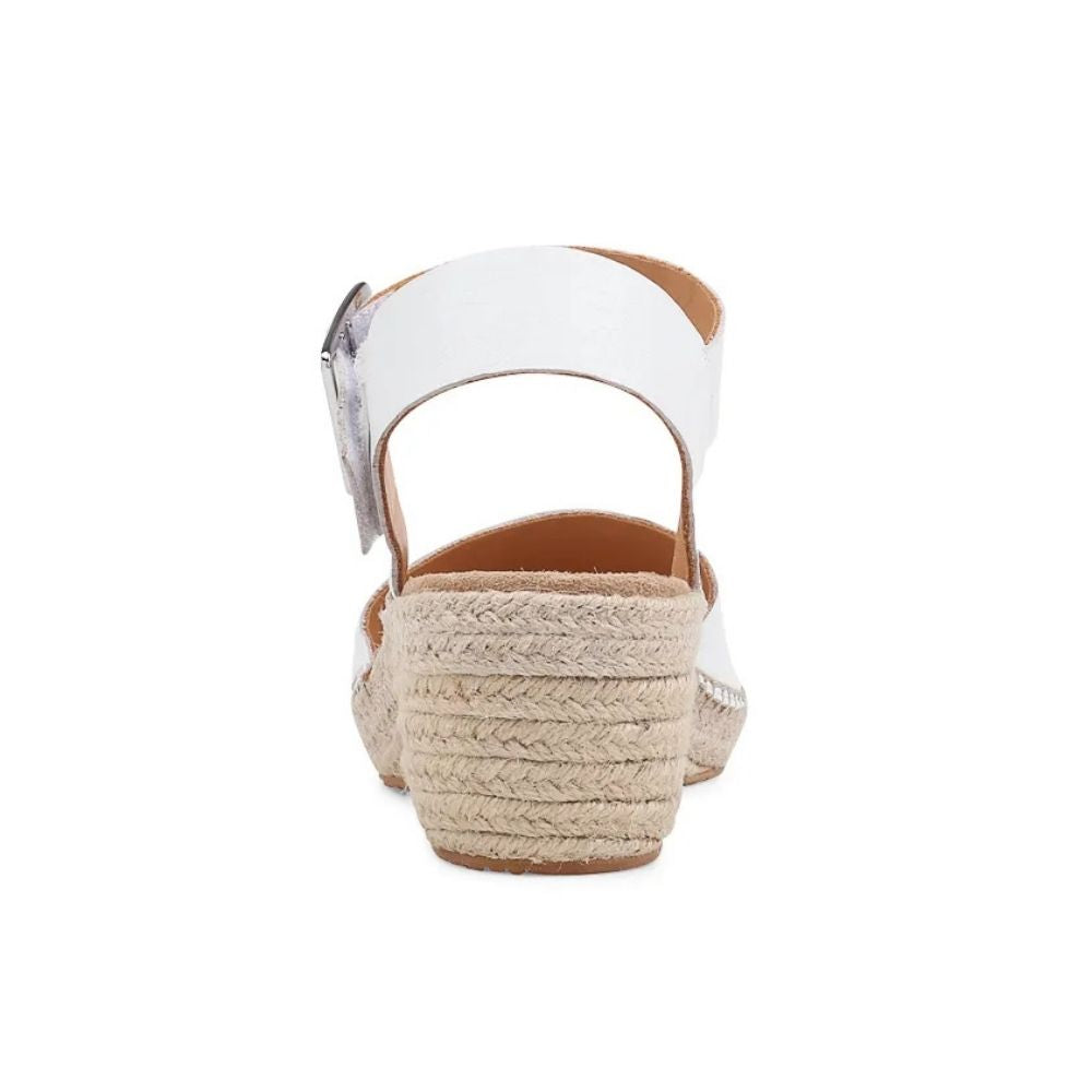 The back of a white leather wedge espadrille sandal with a braided jute wedge heel, shown against a white background.