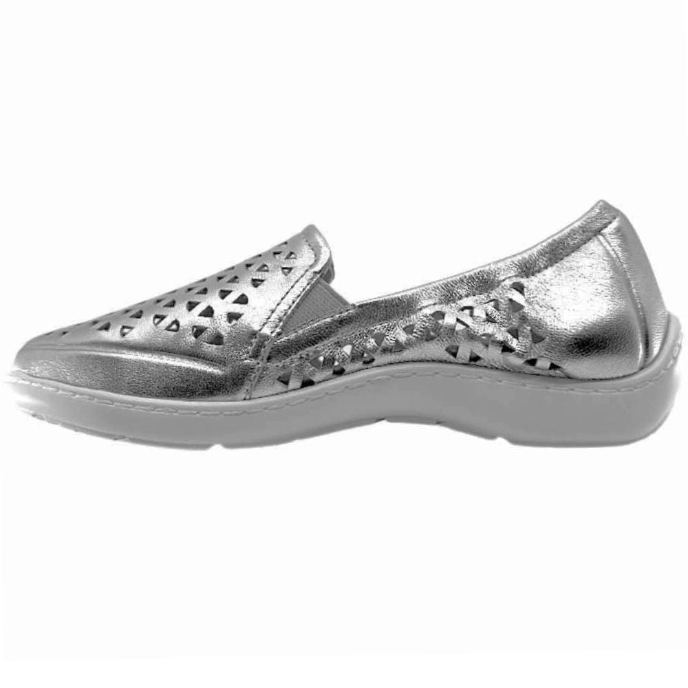 The inside of a single metallic silver slip-on shoe with geometric triangle cutouts on the toe and sides, featuring a white sole, against a white background.