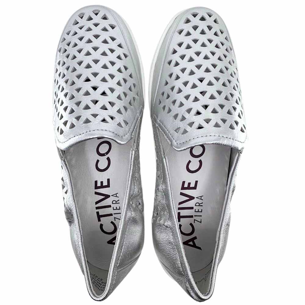 A pair of metallic silver slip-on shoes with geometric triangular cutouts on the upper, shown from a top-down view on a white background. The brand name 'ZIERA' is printed vertically on the insole.