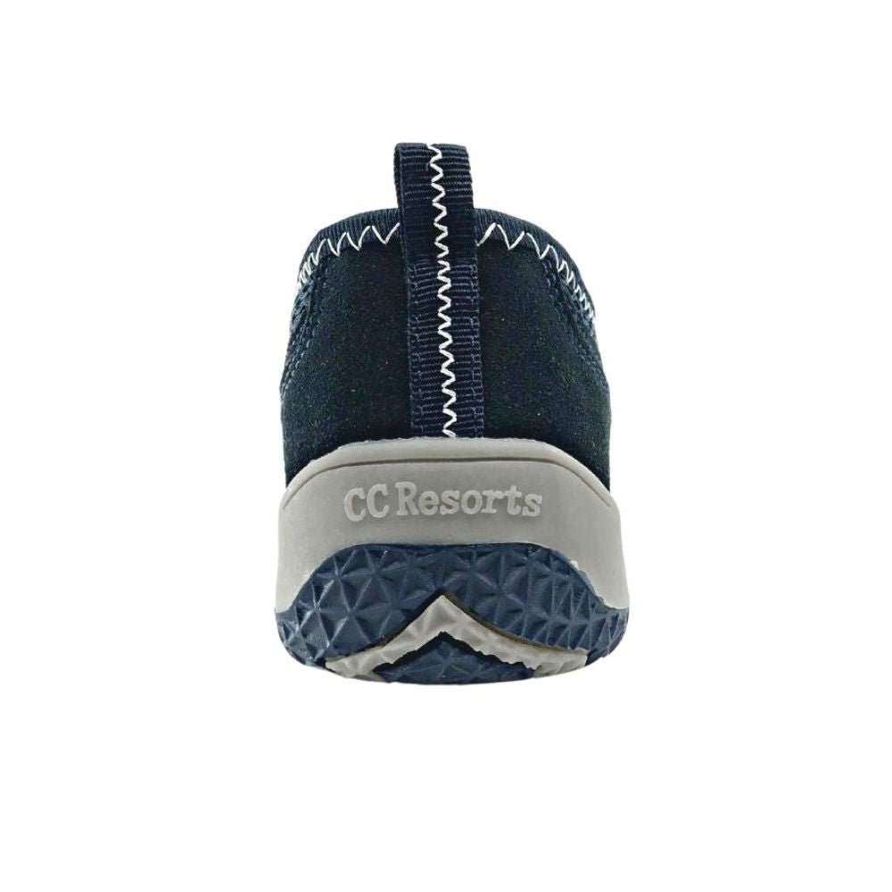 Back of navy blue slip-on shoe on a white background